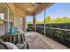 Screened lanai with ceiling fan, table and chairs with view of landscaped backyard at 3148 Sago Point Ct, Land O Lakes, FL 34639