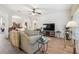 Spacious living area with hardwood floors, modern furniture, and an open layout at 3148 Sago Point Ct, Land O Lakes, FL 34639