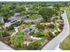 Aerial view of the miniature golf course, showcasing lush landscaping, parking, and meticulously designed greens at 3148 Sago Point Ct, Land O Lakes, FL 34639