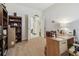 Bright office with a desk and shelving, perfect for remote work or study at 3148 Sago Point Ct, Land O Lakes, FL 34639