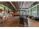 Spacious restaurant interior featuring bar, tables, booth seating, and multiple TV screens for entertainment at 3148 Sago Point Ct, Land O Lakes, FL 34639