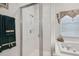 Detailed view of the glass enclosed shower and soaking tub in the main bathroom at 3148 Sago Point Ct, Land O Lakes, FL 34639