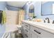 Stylish bathroom with double vanity, modern fixtures, and a tub-shower combination for a spa-like experience at 3434 Tarbolton Way, Land O Lakes, FL 34638