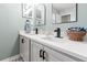 Well-lit bathroom with double sinks, modern fixtures, and ample counter space for comfortable morning routines at 3434 Tarbolton Way, Land O Lakes, FL 34638