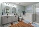 Stylish bathroom with double vanity, soaking tub, and separate shower provides a spa-like experience at 3434 Tarbolton Way, Land O Lakes, FL 34638