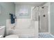 Serene bathroom with a soaking tub, separate shower, and elegant tile work for a luxurious experience at 3434 Tarbolton Way, Land O Lakes, FL 34638