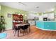 Bright dining area with table and chairs, plus hutch and access to kitchen at 3434 Tarbolton Way, Land O Lakes, FL 34638