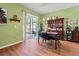 Charming dining area with sliding glass doors and hardwood floors at 3434 Tarbolton Way, Land O Lakes, FL 34638