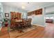 Formal dining room showcasing a wine rack and wood floors at 3434 Tarbolton Way, Land O Lakes, FL 34638
