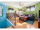 Inviting living room with hardwood floors, comfortable seating, and natural light streaming through the windows at 3434 Tarbolton Way, Land O Lakes, FL 34638