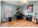 Inviting office area with hardwood floors, ample desk space, and a comfortable atmosphere for productivity at 3434 Tarbolton Way, Land O Lakes, FL 34638