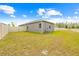 The spacious backyard is enclosed with a white picket fence for extra privacy and outdoor enjoyment at 37587 Mackenzie Dr, Zephyrhills, FL 33540