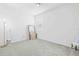 Empty bedroom offers plush carpet and decor ready for personalization at 37587 Mackenzie Dr, Zephyrhills, FL 33540