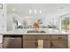 Open concept kitchen with a large island, stainless steel dishwasher, and an eat-in kitchen at 37587 Mackenzie Dr, Zephyrhills, FL 33540