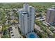 High-rise condominium complex with lush landscaping, pool, and convenient parking at 4141 Bayshore Blvd # 1204, Tampa, FL 33611