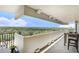 Spacious covered balcony with lush treetop views and a table for outdoor dining at 4141 Bayshore Blvd # 1204, Tampa, FL 33611