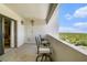Outdoor balcony with patio chairs, fan, and a scenic view at 4141 Bayshore Blvd # 1204, Tampa, FL 33611