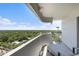 Wide balcony with a lounge chair offering sweeping views of the surrounding lush landscape at 4141 Bayshore Blvd # 1204, Tampa, FL 33611