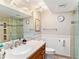Bathroom features glass shower, single vanity, and modern lighting at 4141 Bayshore Blvd # 1204, Tampa, FL 33611