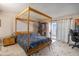 Bedroom with four-poster bed, balcony, and modern furnishings at 4141 Bayshore Blvd # 1204, Tampa, FL 33611