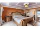 Comfortable main bedroom features rustic furnishings and ensuite bath access at 4141 Bayshore Blvd # 1204, Tampa, FL 33611