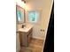 Bathroom featuring a modern vanity, stylish mirror, and window at 4310 Lithia Pinecrest Rd, Valrico, FL 33596