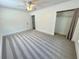 Bright bedroom with plush carpeting, closet, and ceiling fan at 4310 Lithia Pinecrest Rd, Valrico, FL 33596