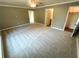 Spacious bedroom with carpet flooring and ensuite bathroom at 4310 Lithia Pinecrest Rd, Valrico, FL 33596