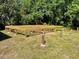 New elevated wood decking structure overlooking the expansive green space and surrounded by trees at 4310 Lithia Pinecrest Rd, Valrico, FL 33596