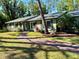 Inviting single-story home featuring a brick path leading to the front door with manicured landscaping at 4310 Lithia Pinecrest Rd, Valrico, FL 33596