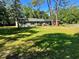 Charming single-story home with well-maintained lawn and mature trees, offering a tranquil setting at 4310 Lithia Pinecrest Rd, Valrico, FL 33596