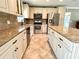 Spacious kitchen with stainless steel appliances and granite countertops at 4310 Lithia Pinecrest Rd, Valrico, FL 33596