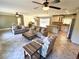 Open-concept living space with tile flooring, neutral tones, and seamless flow to the kitchen area at 4310 Lithia Pinecrest Rd, Valrico, FL 33596