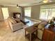 Comfortable living room with a large window view and neutral paint at 4310 Lithia Pinecrest Rd, Valrico, FL 33596