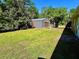 Spacious backyard with a large metal shed providing ample storage at 4310 Lithia Pinecrest Rd, Valrico, FL 33596