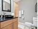 Bathroom with modern vanity, black countertop, and neutral tilework, offering a clean aesthetic at 450 Knights Run Ave # 414, Tampa, FL 33602