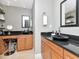 Modern bathroom featuring dual vanities with black countertops and sleek fixtures at 450 Knights Run Ave # 414, Tampa, FL 33602