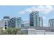 Modern condominium exterior featuring sleek architectural design and reflective glass windows at 450 Knights Run Ave # 414, Tampa, FL 33602