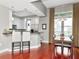 Bright kitchen features a breakfast bar, stainless appliances, and a dining area with a balcony at 450 Knights Run Ave # 414, Tampa, FL 33602