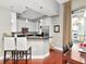 Bright kitchen features a breakfast bar, stainless appliances, and a dining area with a balcony at 450 Knights Run Ave # 414, Tampa, FL 33602