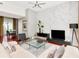 Bright living room with contemporary furniture, marble accent wall, and wood floors in a modern home at 450 Knights Run Ave # 414, Tampa, FL 33602