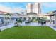 Lounge area with green space and seating with overhead coverings for shade at 450 Knights Run Ave # 414, Tampa, FL 33602