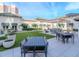 Lounge area with overhead pergola coverings and outdoor seating with green space at 450 Knights Run Ave # 414, Tampa, FL 33602