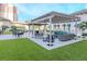 Lounge area with green space, overhead coverings and outdoor seating at 450 Knights Run Ave # 414, Tampa, FL 33602