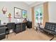 Well-lit home office space with a large desk, modern chair, and window with natural light at 450 Knights Run Ave # 414, Tampa, FL 33602