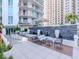 Stylish outdoor lounge featuring fountains, seating, and lush greenery near high-rise condominiums at 450 Knights Run Ave # 414, Tampa, FL 33602