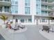 Courtyard patio area with outdoor seating and landscaping at 450 Knights Run Ave # 414, Tampa, FL 33602