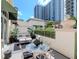 Charming outdoor patio with stylish furniture and well-manicured landscaping at 450 Knights Run Ave # 414, Tampa, FL 33602