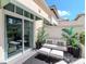 Inviting patio with cozy seating area surrounded by lush greenery at 450 Knights Run Ave # 414, Tampa, FL 33602