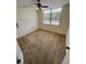 Cozy bedroom featuring a window with neighborhood views and neutral colored walls at 4715 Bay Ne St # 235, St Petersburg, FL 33703